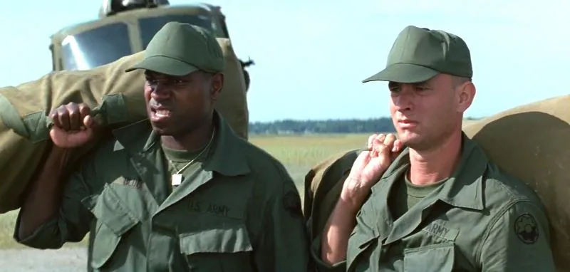 Mykelti Williamson and Tom Hanks in Forrest Gump 1994 as Bubba and Forrest.